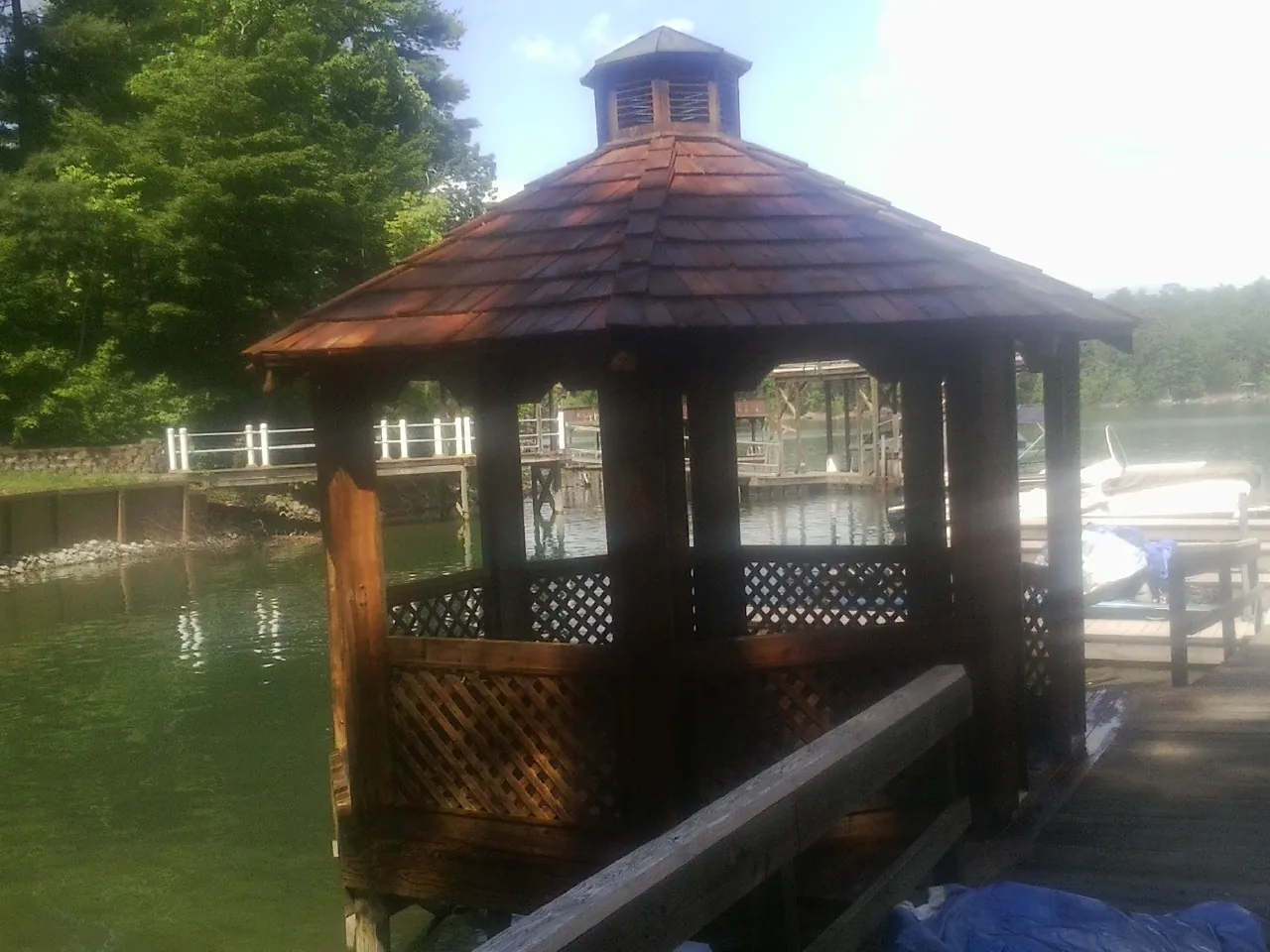 Cedar shake gazebo roof rebuilt on a lake dock in Manson